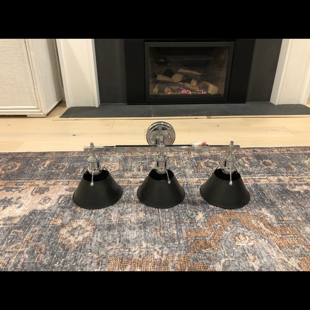 Brand new 3 light sconce. Black & chrome